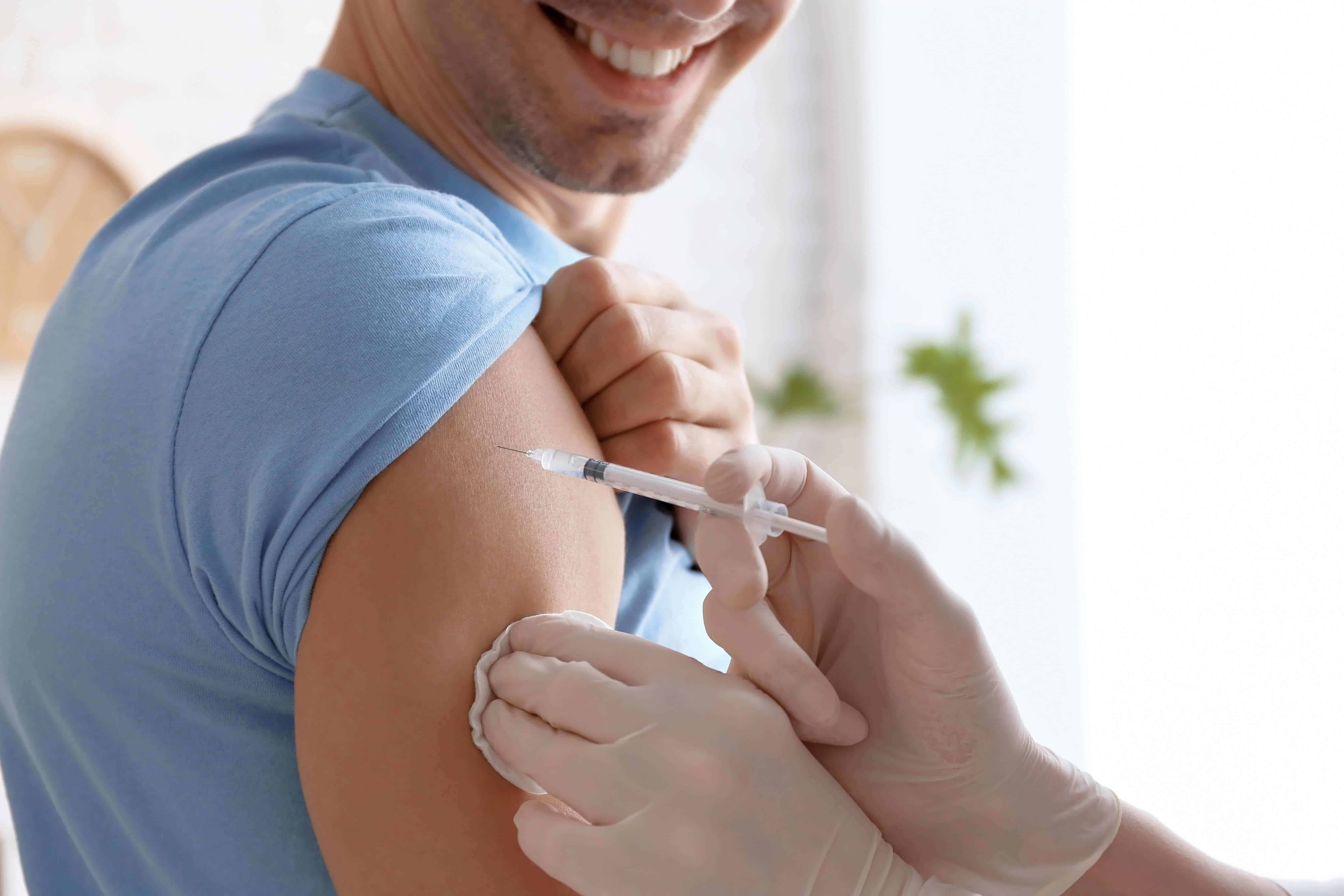 Doctor vaccinating a patient