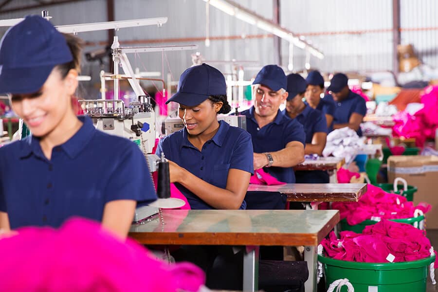 Factory workers working in clothing factory