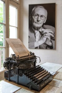 Portrait and original vintage typewriter in Herman Hesse museum in Montagnola Photo Shutterstock LiliGraphie