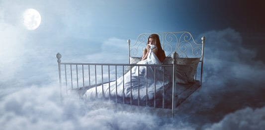 Woman waking up in her dream - Lucid dreaming