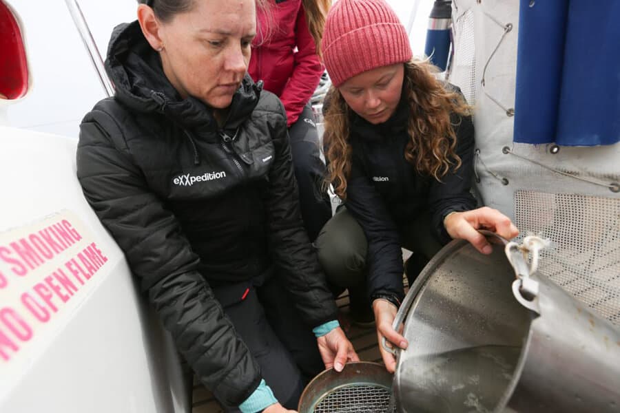 Dr. Emily Duncan and her team collecting samples from the ocean