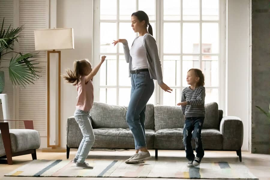 Family dancing to the music at home