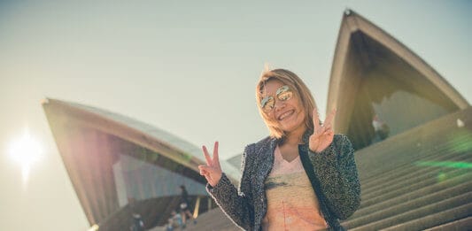 Student by Sydney Opera House in Sydney Australia