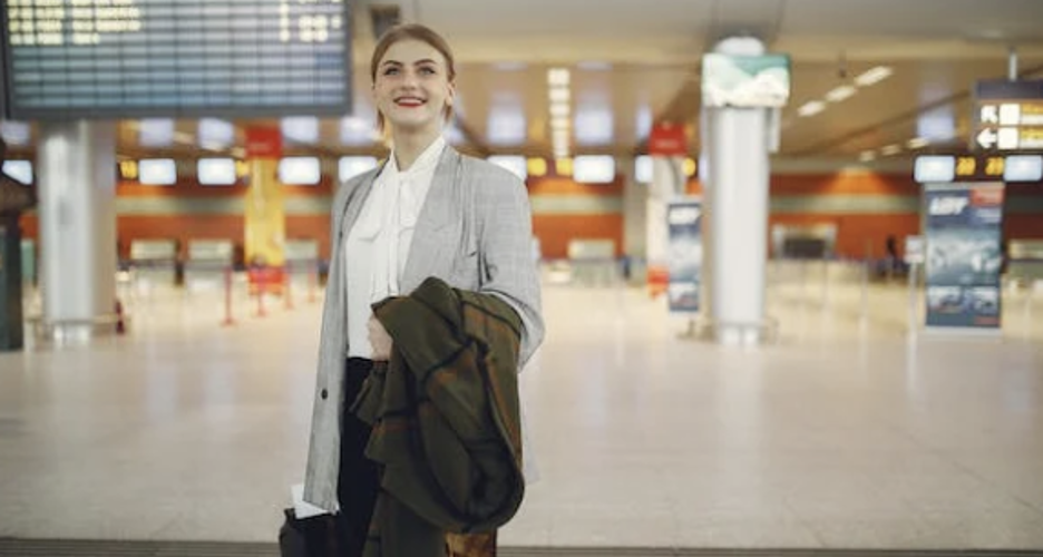 A woman looking up in an airport.